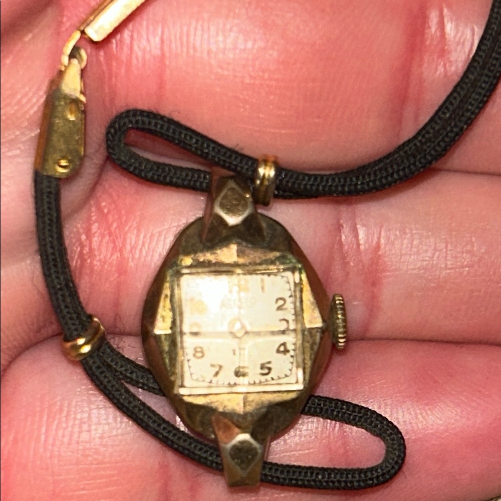 Vintage Gold-Tone Watch with Black Strap